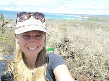 Selfie photo of women wearing hat with coastal background