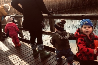young children on the boardwalk at low barns nature reserve