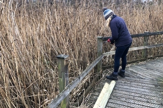 Ali fixing damage to the boardwalk