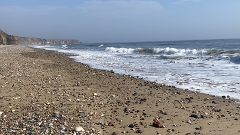 Rocky beach with sea in background