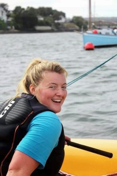 Gemma on a boat, smiling at the camera