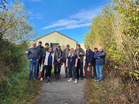 Group of people in front of bird hide