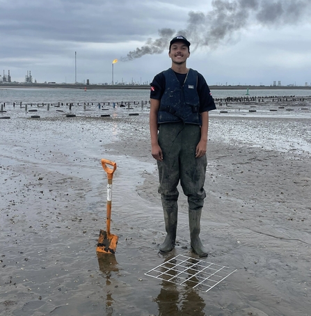 Adam Rounce standing on beach