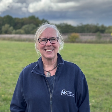 Photo of Lisa Baldini standing in front of grassed area