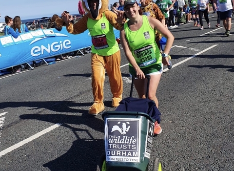 Fundraisers taking part in the Great North Run, including Laura dressed as a fox and Dee pushing a donation bin